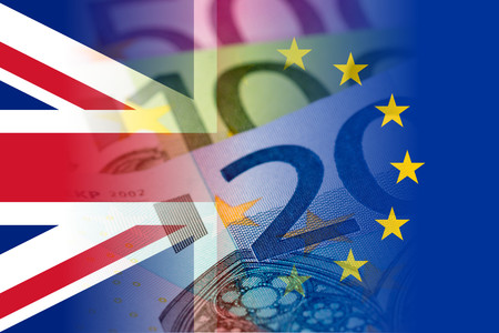united kingdom and eu flags with euro banknotes mixed imageの写真素材