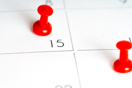 two red pins on calendar gridの写真素材
