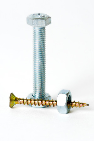 small golden screws, silver bolt and big silver nutの写真素材