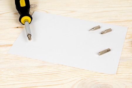 screwdriver on paper sheet postcardの写真素材