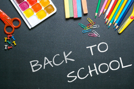 back to school white chalk text on blackboardの写真素材
