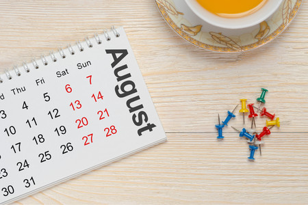 august notepad calendar on white deskの写真素材