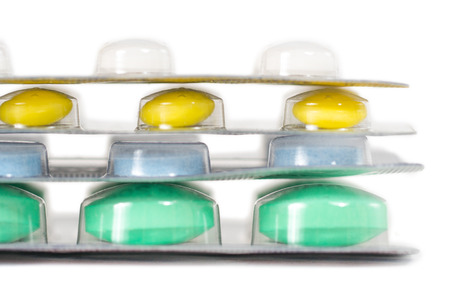 colorful vitamin and antibiotic in blister on whiteの写真素材