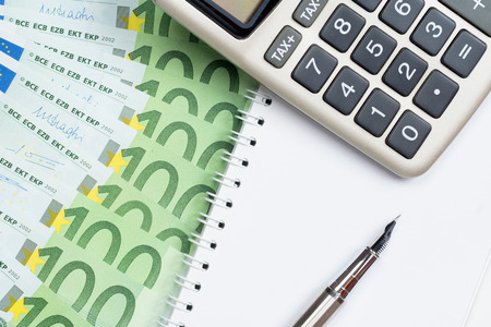 profit calculation concept with euro banknotes and calculatorの写真素材