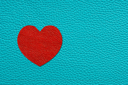 red heart on turquoise leatherの写真素材