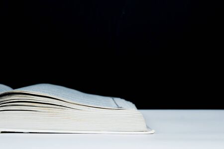 part of opened book with blackboard background, back to school conceptの写真素材