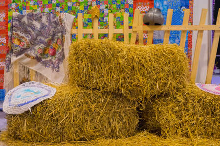 hay bale near wooden fence, country house themeの写真素材