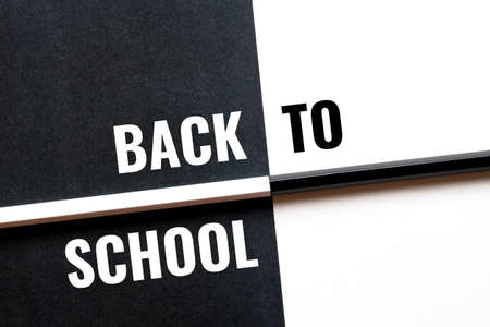 back to school, black and white concept with paper sheets and pencilsの写真素材