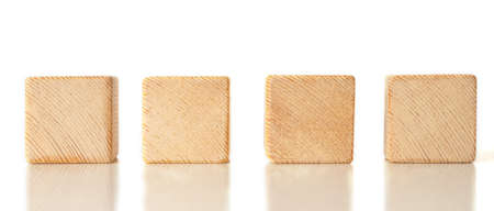 4 wooden cubes on white backgroundの写真素材