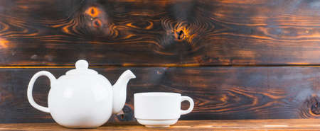 tea cup and pot on rustic wooden table, panoramic shotの写真素材