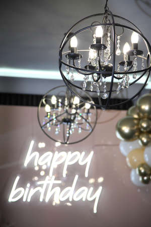 Festive decoration of the hall. Photo zone in the restaurant with the inscription "Happy Birthday!" Birthday party decoration.の写真素材