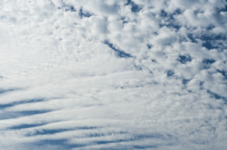 Blue sky with some cloudsの写真素材