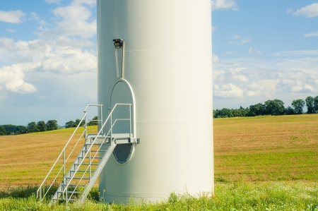 An image of windturbines against blue skyの写真素材
