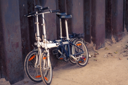 An image of two bikes near the steel fenceの写真素材