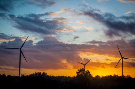 Windmills during sunset in summer timeの写真素材