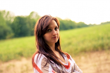 Outdoors portrait of beautiful young brunette girlの写真素材