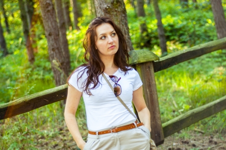 An image o girl walking through the forest pathwayの写真素材