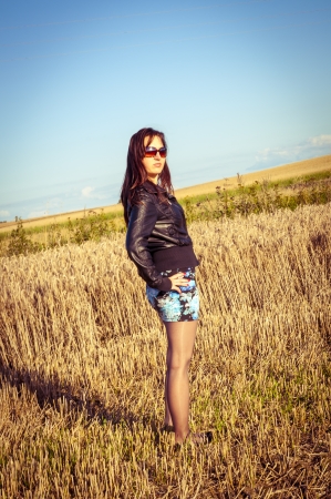 An image of brunette girl portrait in the fieldの写真素材