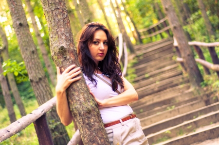 An image o girl walking through the forest pathwayの写真素材