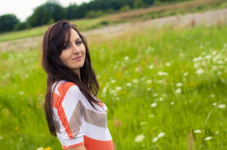 Outdoors portrait of beautiful young brunette girlの写真素材