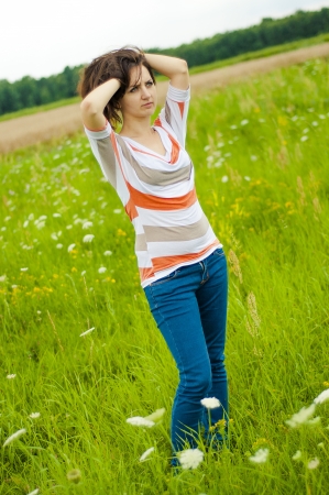 Outdoors portrait of beautiful young brunette girlの写真素材