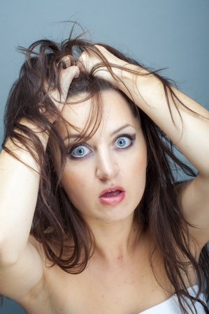 an image of young brunette woman thinkingの写真素材