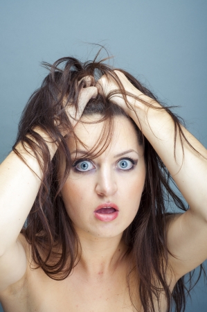 an image of young brunette woman thinkingの写真素材