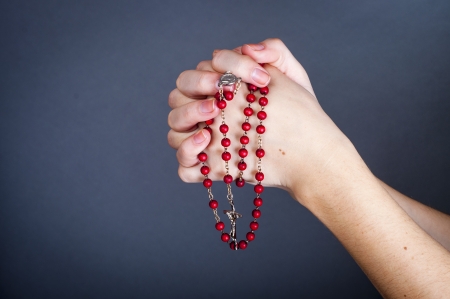 an image of rosary on female handの写真素材