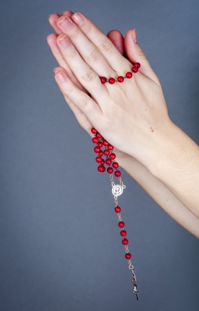 an image of rosary on female handの写真素材