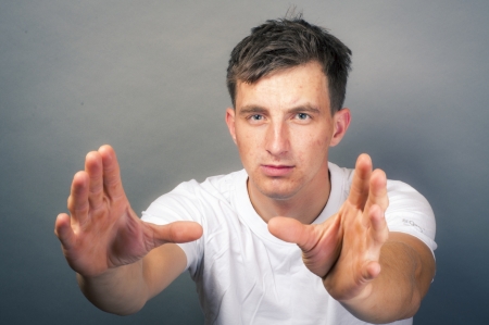 an image of young man with hand want to take somethingの写真素材
