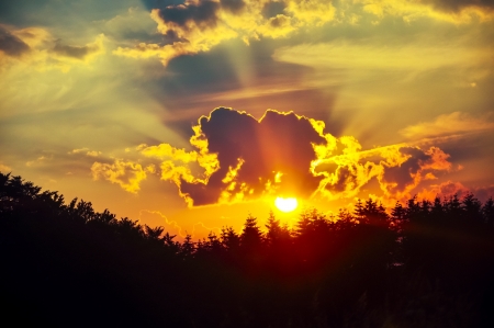 An image of Dark sky with storm clouds during sunsetの写真素材