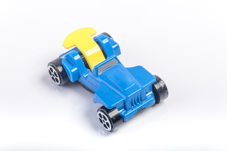 An image of blue toy car isolated on white background