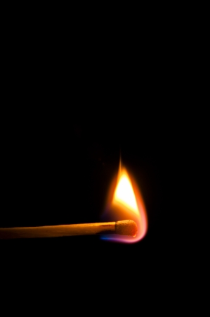 An image of firing match on black backgroundの写真素材
