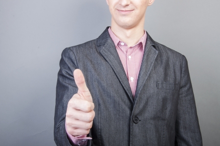 An image of Businessmen handshake  isolated on gray backgroundの写真素材