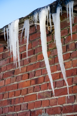 An image of icicles on the roofの写真素材