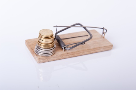 An image of mousetrap with money isolated on whiteの写真素材