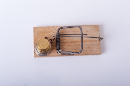 An image of mousetrap with money isolated on whiteの写真素材
