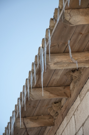 An image of icicles on the roofの写真素材