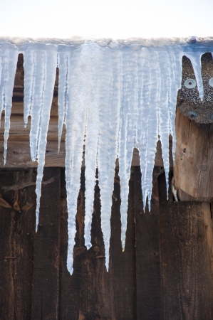 An image of icicles on the roofの写真素材