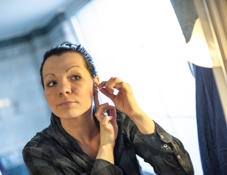 An image of woman doing morning make up in bathroomの写真素材