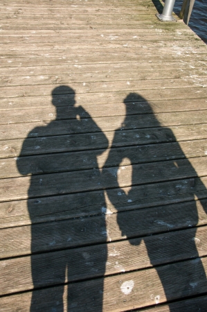 tourists walking on the beachの写真素材