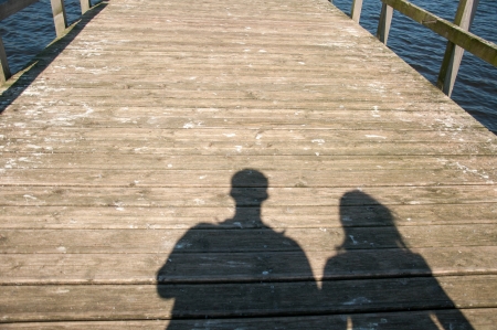 tourists walking on the beachの写真素材