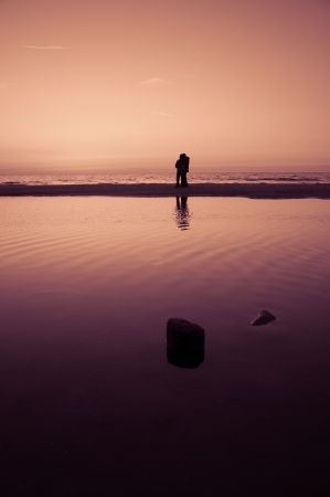 tourists walking on the beachの写真素材
