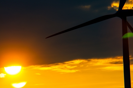 An image of wind turbines at sunsetの写真素材