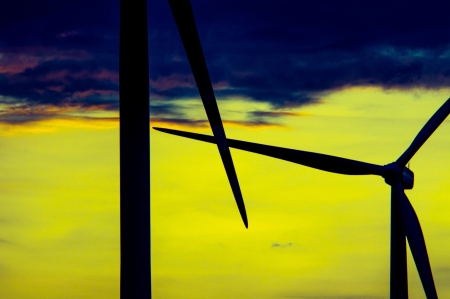 An image of wind turbines at sunsetの写真素材