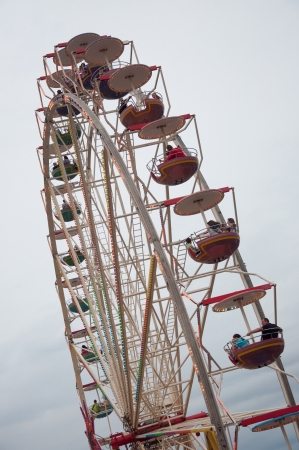 SZCZECIN - AUGUST 04: Visitors on Ferris Wheel during the final of The Tall Ships Races 2013 in Szczecin, August 04, 2013 in Szczecin, Poland.のeditorial素材