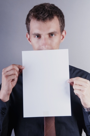 an image of young handsome businessman with blank cardの写真素材