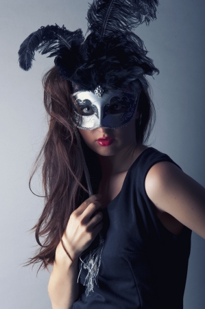 an image of beautiful young girl with venetian maskの写真素材
