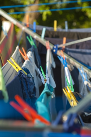 an image of clothes hanging on the dryerの写真素材