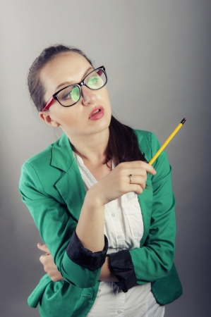 an image of attractive young businesswoman thinkingの写真素材